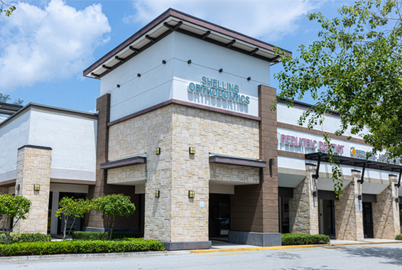 Modern orthodontic office building with stone and brick facade in Boca Raton